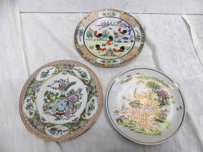 three plates are sitting on a table with a white table cloth