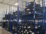 many tires stacked on the shelves in the warehouse