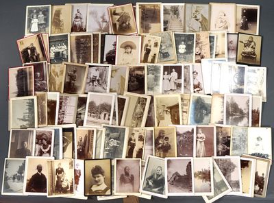 a lot of old photos of people on the table