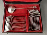 silverware in a red case on a table with a red cloth