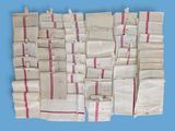 a pile of bags with red and white stripes on them