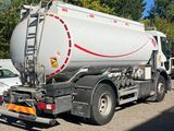 a large tanker truck that is parked on the side of the road