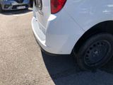 a white van that is parked in a parking lot