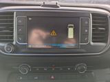 a picture of a car dashboard with a cell phone in it