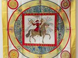 an image of a yellow scarf with a picture of a man on a horse
