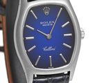 the blue dial of a rolex watch is displayed against a white background
