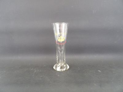 a clear glass with a red and yellow design on it