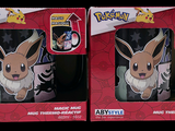 two boxes of pokemon mugs sitting on top of a table