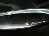 a close up of a glass object with writing on it