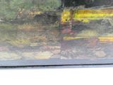 une peinture représentant un bulldozer jaune dans un champ