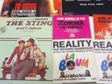 many different movie posters on the wall of a room
