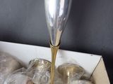 a lot of silver cups in a box on the table