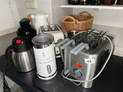 a blender and a toaster on a counter in a kitchen