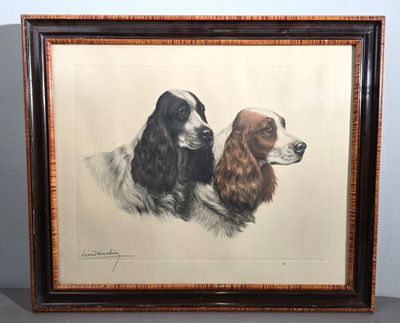 painting of two spaniels in a frame on a table