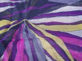 purple, yellow, black, and white striped fabric with a flower design