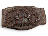 a belt buckle with a picture of a man and a dog on it