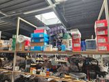 a large amount of items on the shelves in the warehouse