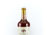 a bottle of wine sitting on top of a white surface