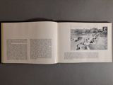 an open book with a picture of a bridge in it