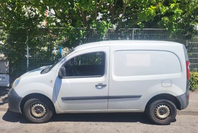a white van that is parked in the parking lot