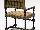 an image of a wooden chair with a striped upholstered seat