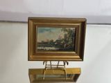 a picture of a painting on a stand on a table