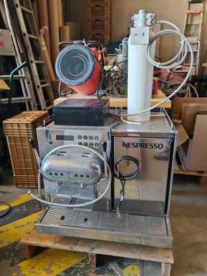 a machine that is sitting on a pallet in a warehouse