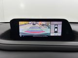 the rear view mirror of a car with a camera mounted to it ' s dash