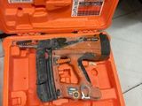 a tool in the orange case on the floor