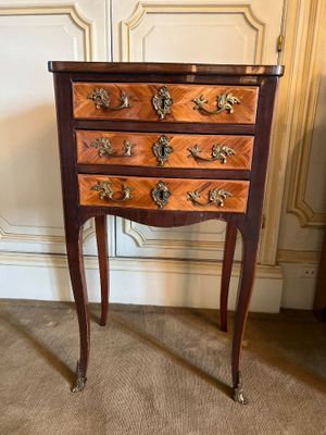 an image of a wooden chest of drawers in a room