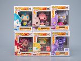 Plusieurs types de figurines Pop Vinyl sont présentés dans une boîte