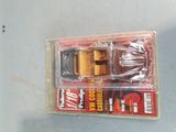 a toy truck that is in a package on a table