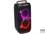 a black speaker with a red light on top of it