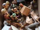 many figurines in a box that are in the box