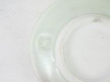a close up of a white plate on a table