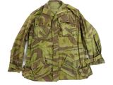 an old military jacket with a camouflage pattern on it