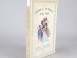 un livre ouvert sur lequel figure la photo d'un groupe de personnes