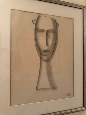 une photo représentant un dessin du visage d'un homme sur le mur