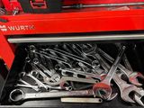many wrenches in the drawer of a tool box