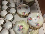 a lot of plates and bowls on the table