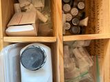 a wooden shelf with a blender and other items in it