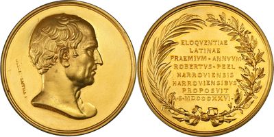 a close up of a gold coin with a portrait of a man
