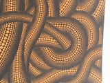 a close up of a piece of art with dots on it