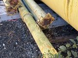 a large yellow pipe that is laying on the ground