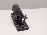 a statue of a bull that is sitting on a table
