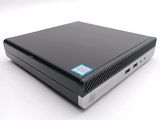 a close up of a small black computer on a white surface