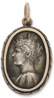 une pièce d'argent sur laquelle figure, au centre, le profil d'une femme