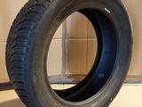 a close up of a tire sitting on top of a cardboard box