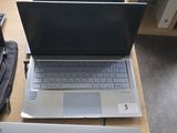 two laptops that are sitting on a table