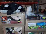 a black and white whale stuffed animal sitting on top of a box